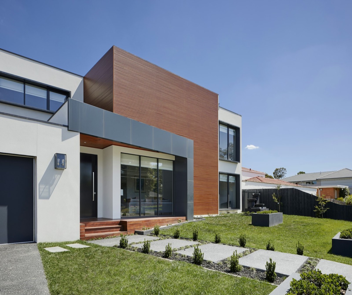 Modern home exterior with a charcoal garage door
