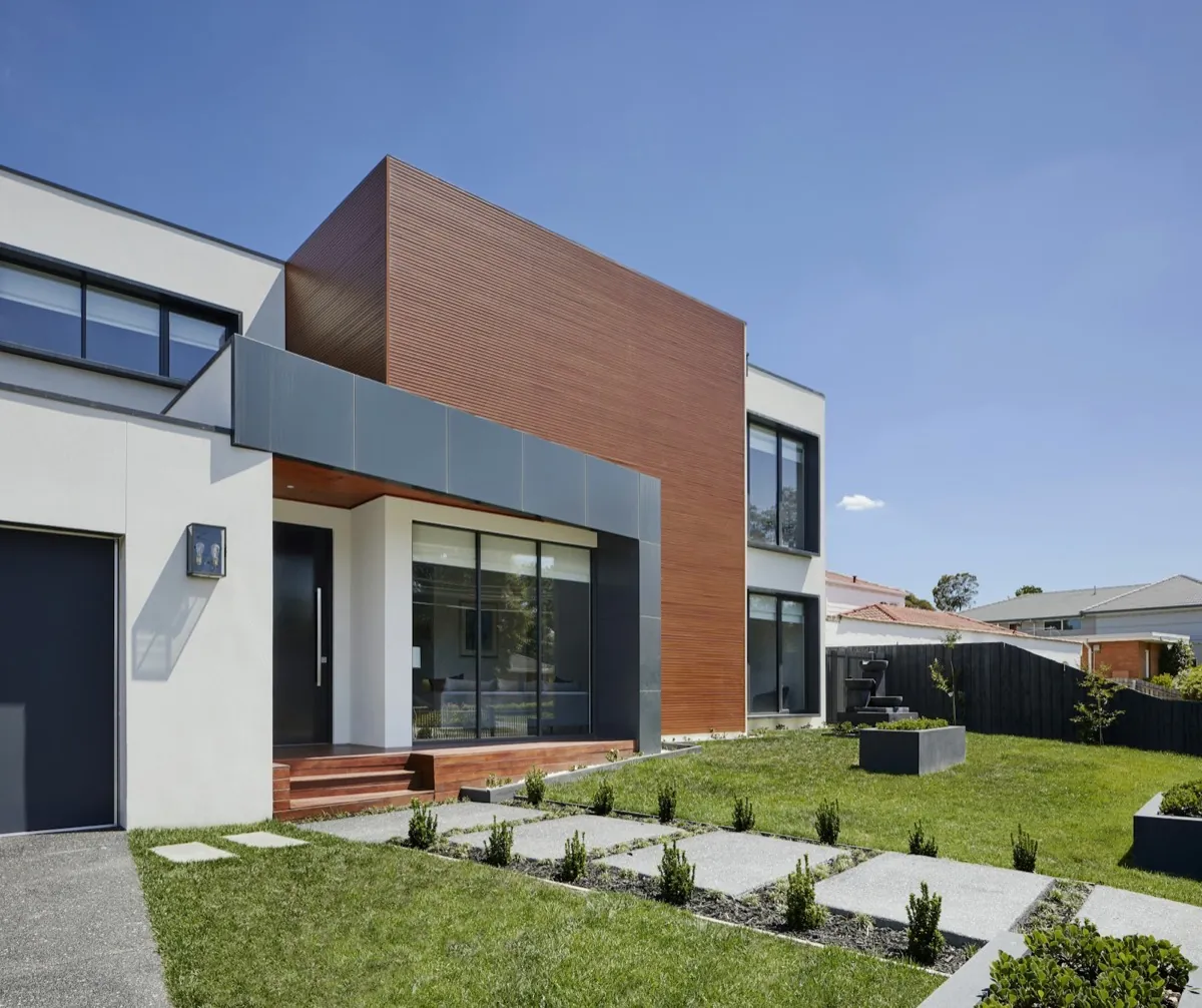 Modern home exterior with a charcoal garage door