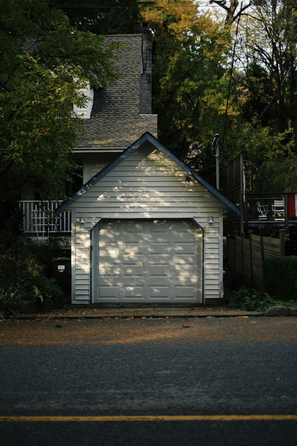 White residential garage door on a detached garage