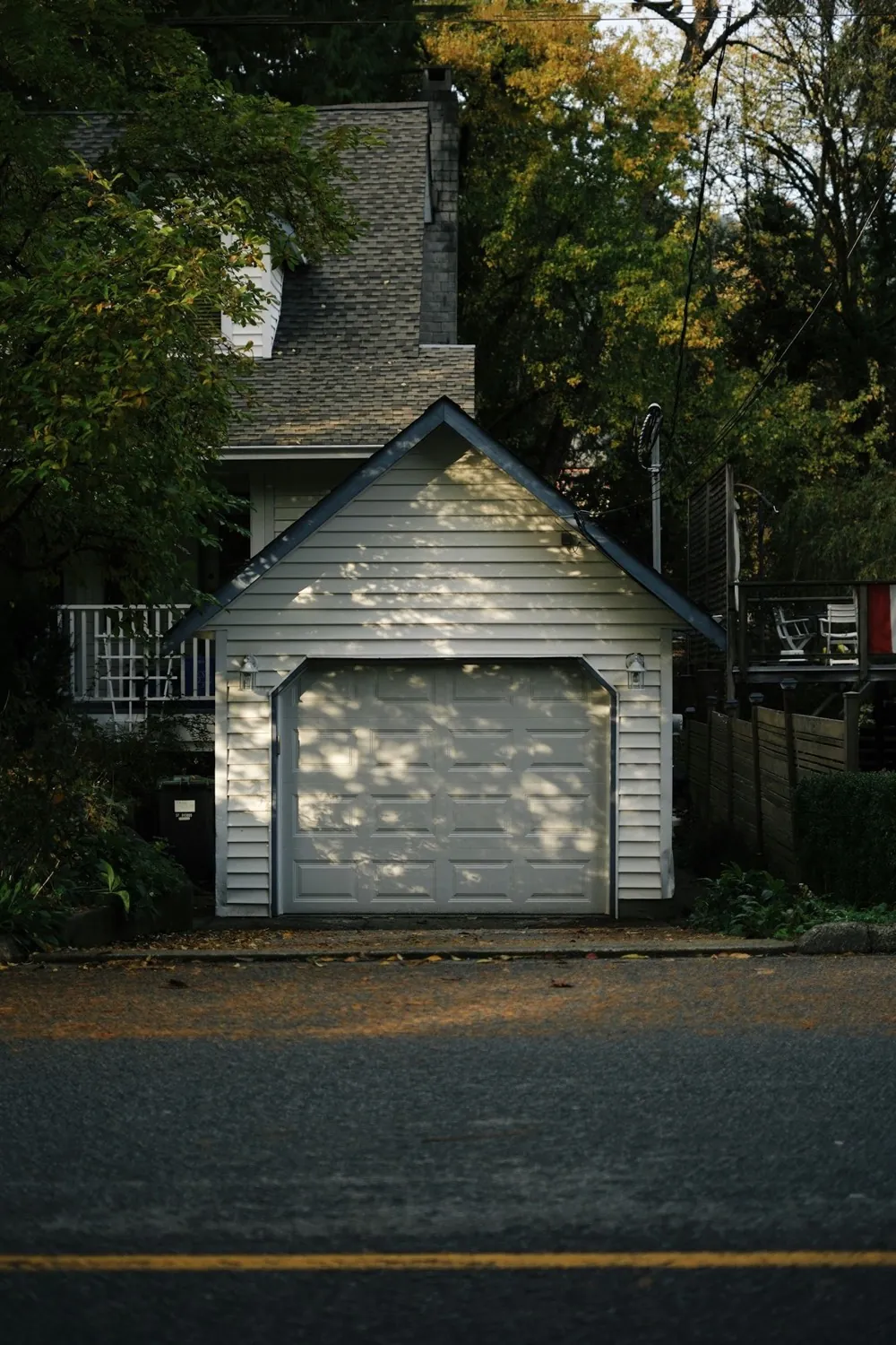 White residential garage door on a detached garage